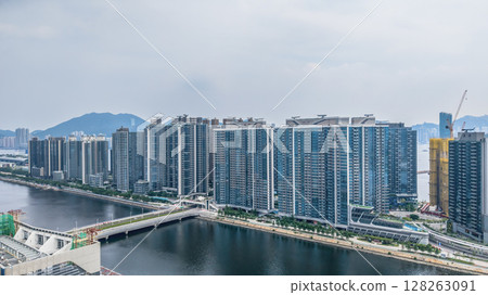 July 6 2025 Modern High-Rise Residential Towers with Urban Waterfront Views July 6 2025 Modern High-Rise Residential Towers with Urban Waterfront Views 128263091