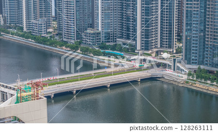 July 6 2025 Rise Buildings by a Riverside Promenade and Urban Bridge July 6 2025 Rise Buildings by a Riverside Promenade and Urban Bridge 128263111