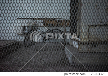 Air-conditioned facility and bicycles enclosed by wire mesh Air-conditioned facility and bicycles enclosed by wire mesh 128263328