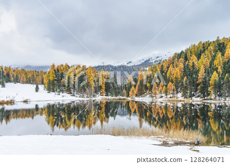 Autumn landscape with mountain hatred lags and first snowfalls 128264071