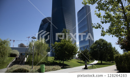 Milan skyline with modern skyscrapers un a sunny day Milan skyline with modern skyscrapers un a sunny day 128264283