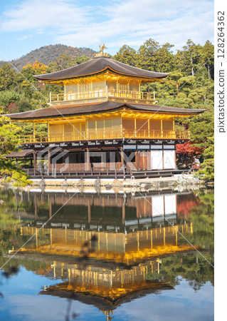 Kinkaku-ji Golden Pavilion Temple in Kyoto Japan, Golden temple reflecting on still water in a serene landscape. Kinkaku-ji Golden Pavilion Temple in Kyoto Japan, Golden temple reflecting on still water in a serene landscape. 128264362