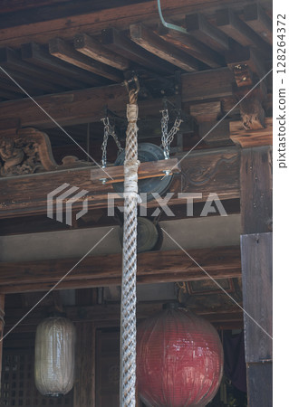 Traditional wooden architecture with lanterns and intricate details. Traditional wooden architecture with lanterns and intricate details. 128264372