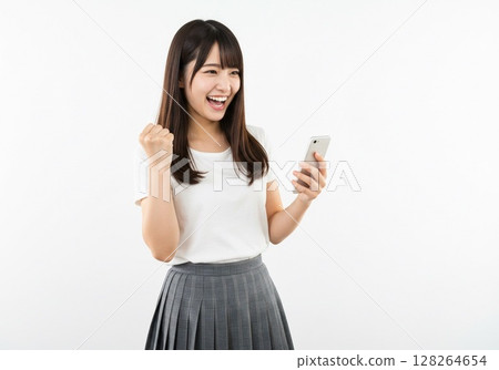 A Japanese woman posing in a fist pump while looking at her smartphone screen (white background, for cutting) A Japanese woman posing in a fist pump while looking at her smartphone screen (white background, for cutting) 128264654