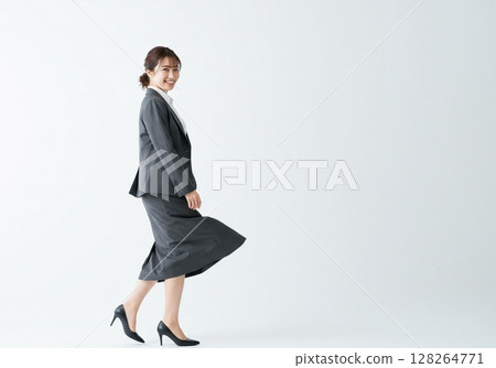 Japanese OL pose/turning around (white background, for cutting) Japanese OL pose/turning around (white background, for cutting) 128264771