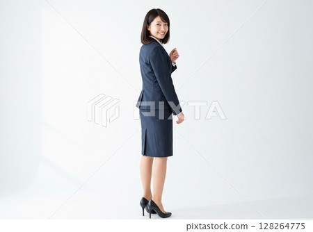 Japanese OL pose/turning around (white background, for cutting) Japanese OL pose/turning around (white background, for cutting) 128264775