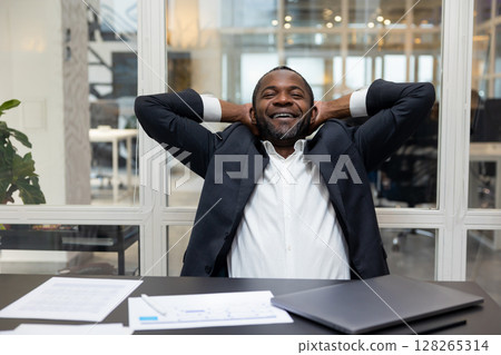 African american businessman feeling relaxed after a long busy working day 128265314