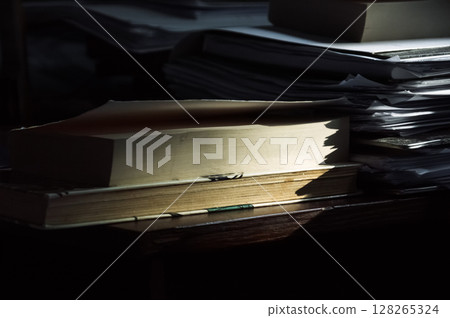 Stack of old books on a wooden table. Selective focus. 128265324