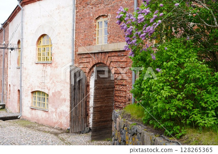 A building with a wooden gate on the World Heritage site of Suomenlinna A building with a wooden gate on the World Heritage site of Suomenlinna 128265365