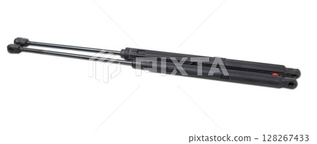 A pair of black metal hood shock absorbers with chrome elements - detail of a car mechanism on a white isolated background. Spare parts for body repair A pair of black metal hood shock absorbers with chrome elements - detail of a car mechanism on a white isolated background. Spare parts for body repair 128267433
