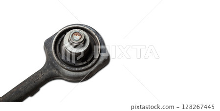 Close-up of a silent block on a used aluminum suspension with fasteners, spare parts for sale during junk yard or for replacement during car service 128267445