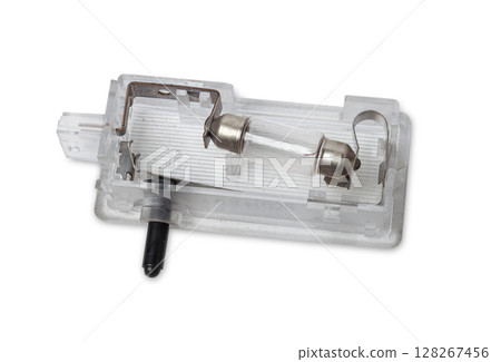 spare part from the car on a white isolated background is a cover for the illumination of a standard sign on the trunk lid for replacement and repair. Spare parts catalog. spare part from the car on a white isolated background is a cover for the illumination of a standard sign on the trunk lid for replacement and repair. Spare parts catalog. 128267456