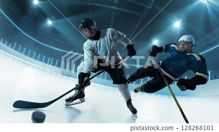 Close-up hockey clash with puck flying toward viewer on 3D ice rink Close-up hockey clash with puck flying toward viewer on 3D ice rink 128268101