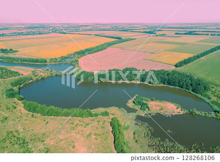 Aerial view of meandering river and arable fields 128268106