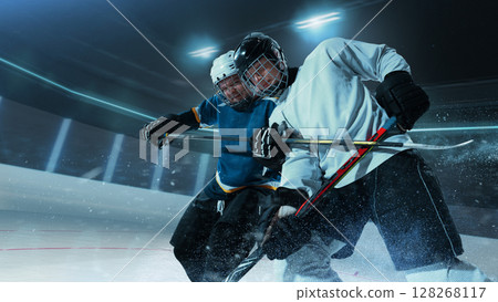 Intense ice hockey game between two players in action on 3D ice rink 128268117