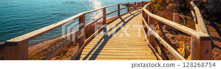 A wooden platform on the beach. Horizontal banner 128268754