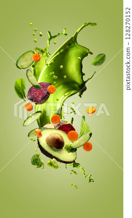 Hand made collage. Green vegetable splash with avocado and fresh ingredients on green background 128270152
