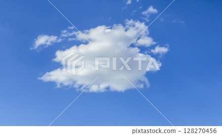 Blue sky with clouds flying birds and green branches Summer nature. White clouds Blue sky with clouds flying birds and green branches Summer nature. White clouds 128270456