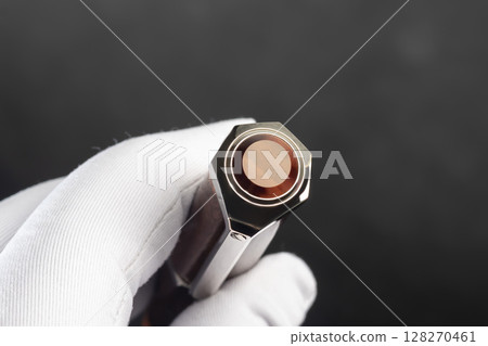 Branded pen with cufflinks and business card holder in a box. Gift set. Office interior. 128270461