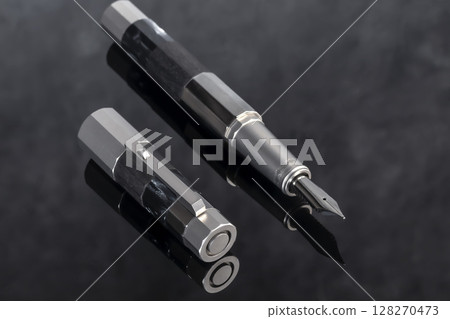 Branded pen with ink and nib in a box. Gift set. Office interior. 128270473