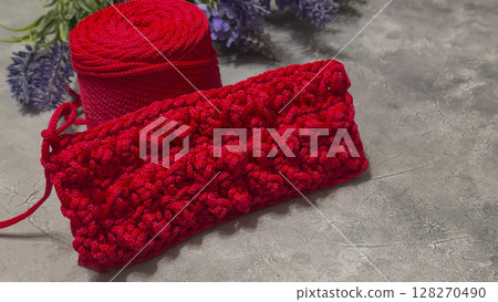 Pattern for knitting a bag. Crocheted from polyester cord. On a gray background 128270490