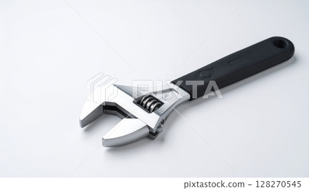 Adjustable metal spanner tool isolated on a white background 128270545