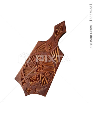 Wooden cutting board for kitchen with geometric patterns on white background Wooden cutting board for kitchen with geometric patterns on white background 128270881