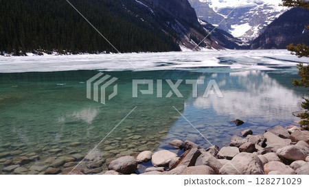 Thawing ice reveals clear lake Thawing ice reveals clear lake 128271029