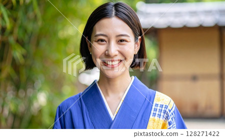 woman wearing a blue kimono 128271422
