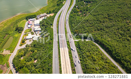 Drone shot The M6 motorway Nakhon Ratchasima Province - Bang Pa-in Lam Ta Khong River and Mountain. Motorway Korat Thailand Drone shot The M6 motorway Nakhon Ratchasima Province - Bang Pa-in Lam Ta Khong River and Mountain. Motorway Korat Thailand 128271881