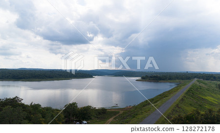 Drone shot. Aerial view scenic landscape of a large river delta amid a lush forest at the tropical Asia place 128272178