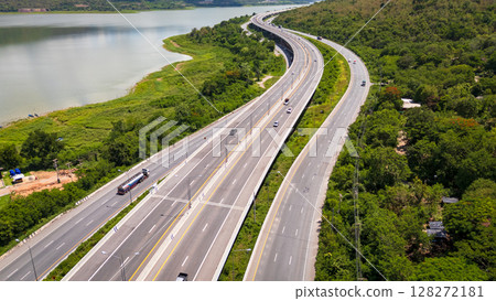 Drone shot The M6 motorway Nakhon Ratchasima Province - Bang Pa-in Lam Ta Khong River and Mountain. Motorway Korat Thailand Drone shot The M6 motorway Nakhon Ratchasima Province - Bang Pa-in Lam Ta Khong River and Mountain. Motorway Korat Thailand 128272181