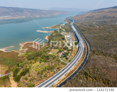 Drone shot aerial view landscape of the M6  motorway Expressway Nakhon Ratchasima Province - Bang Pa-in. Lam Ta Khong River and Mountain. Drone shot of scenic landscape rural place traffic. Nakhon 128272190