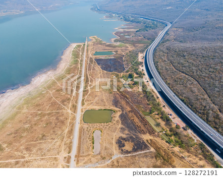 Drone shot aerial view landscape of the M6 motorway Expressway Nakhon Ratchasima Province - Bang Pa-in. Lam Ta Khong River and Mountain. Drone shot of scenic landscape rural place traffic. Nakhon Drone shot aerial view landscape of the M6 motorway Expressway Nakhon Ratchasima Province - Bang Pa-in. Lam Ta Khong River and Mountain. Drone shot of scenic landscape rural place traffic. Nakhon 128272191