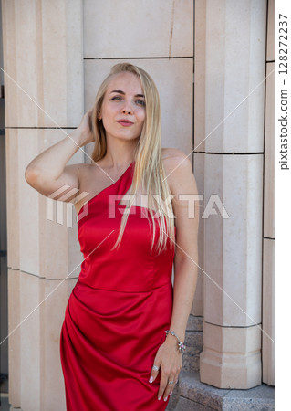 Beautiful fashion blonde in red evening dress Beautiful fashion blonde in red evening dress 128272237