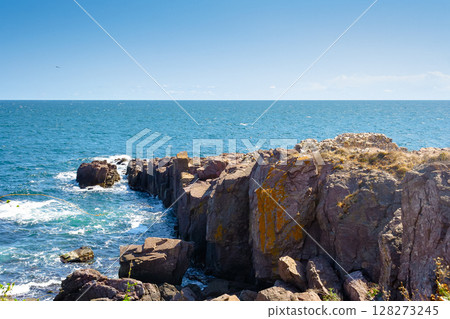 landscape with sea and coast with rock. vacation season with beautiful seascape in summer. travel background with water splash on stone landscape with sea and coast with rock. vacation season with beautiful seascape in summer. travel background with water splash on stone 128273245