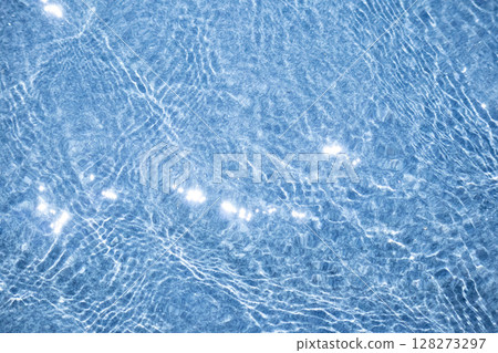 Blue water surface and sparkling sunlight reflected Blue water surface and sparkling sunlight reflected 128273297