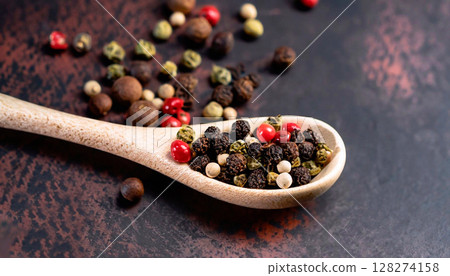 photo of various peppercorns in a spoon on a dark background photo of various peppercorns in a spoon on a dark background 128274158