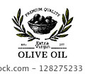 Label for extra virgin olive oil. Vintage logo stylized with 1977 design with olives and leaves 128275233