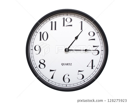 Round analog wall clock with a black frame, white face, and bold black numerals. showing  01:15 or 13:15. Isolated on a white background. Ideal for time-related themes. 128275923