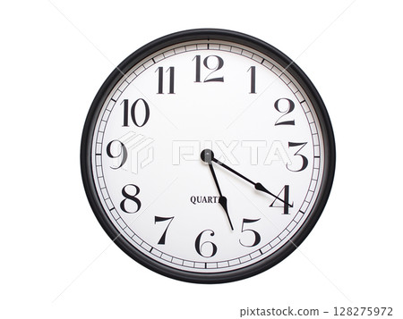 Round analog wall clock with a black frame, white face, and bold black numerals. showing 05:20 or 17:20. Isolated on a white background. Ideal for time-related themes. Round analog wall clock with a black frame, white face, and bold black numerals. showing 05:20 or 17:20. Isolated on a white background. Ideal for time-related themes. 128275972