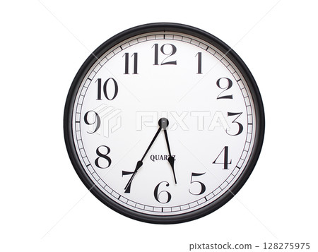 Round analog wall clock with a black frame, white face, and bold black numerals. showing  05:35 or 17:35. Isolated on a white background. Ideal for time-related themes. 128275975