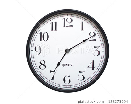 Round analog wall clock with a black frame, white face, and bold black numerals. showing  07:10 or 19:10. Isolated on a white background. Ideal for time-related themes. Round analog wall clock with a black frame, white face, and bold black numerals. showing  07:10 or 19:10. Isolated on a white background. Ideal for time-related themes. 128275994
