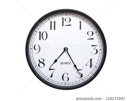 Round analog wall clock with a black frame, white face, and bold black numerals. showing  07:25 or 19:25. Isolated on a white background. Ideal for time-related themes. 128275997