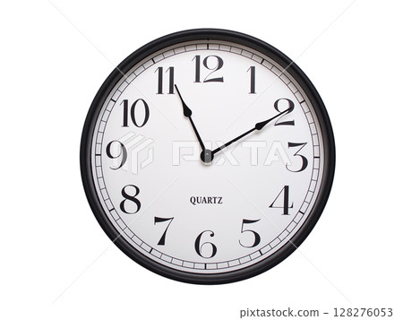 Round analog wall clock with a black frame, white face, and bold black numerals. showing  11:10 or 23:10. Isolated on a white background. Ideal for time-related themes. 128276053