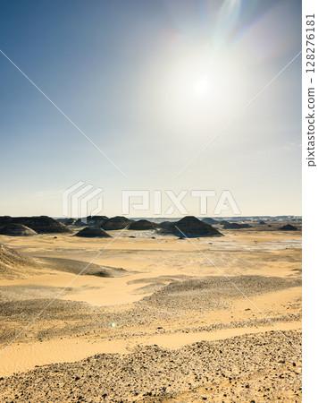 White rock formations and sand dunes in Egypt's White Desert, natural desert landscape White rock formations and sand dunes in Egypt's White Desert, natural desert landscape 128276181
