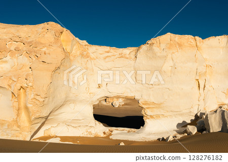 White rock formations and sand dunes in Egypt's White Desert, natural desert landscape 128276182