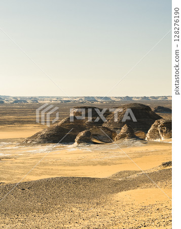 White rock formations and sand dunes in Egypt's White Desert, natural desert landscape 128276190