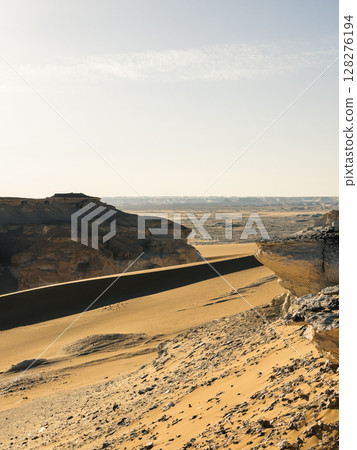 White rock formations and sand dunes in Egypt's White Desert, natural desert landscape White rock formations and sand dunes in Egypt's White Desert, natural desert landscape 128276194