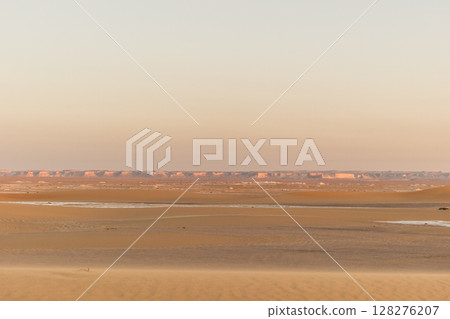 White rock formations and sand dunes in Egypt's White Desert, natural desert landscape 128276207
